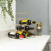 Gold metal wine rack holding 10 bottles of red and white wine with gold colouring makes it stylish and functional