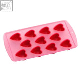 Pink silicone heart shapes ice cube tray with 11 heart shapes molds in a red tray for fun ice cubes