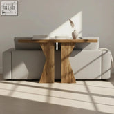 A sleek light wood 140cm console table with a k-shaped x base and minimalist design for entryway or sofa use