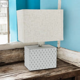 Square 20cm table lamp with white textured fabric shade and gray base featuring intricate geometric pattern