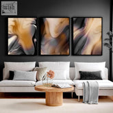 Three framed abstract wall art set with swirling beige gray and muted gold patterns for contemporary decor