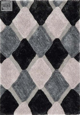 A plush 3d grey geometric shaggy rug with bold black gray and soft pink interlocking diamond pattern