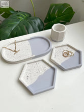 Modern concrete trinket trays in lilac split with speckled white and gray two-tone geometric hex and oval shapes