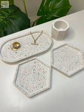 White terrazzo tray with pink green and gray speckles from a 4 piece trinket set for organizing small items
