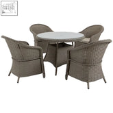 Gray woven wicker outdoor dining set with round glass table, four chairs, and seat cushions for patio use