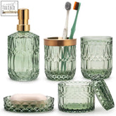 Green faceted glass bathroom accessories set with gold tone accents including soap dish and cotton swab jars
