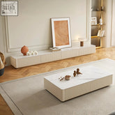 Cream-colored abigail stylish tv stand with a white sintered stone marble top and vertical ribbed sides coffee table