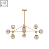 Abira gold 10 arm pendant light with nine spherical glass bulbs in a gold-toned geometric arm pendant design