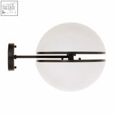 Abira matt black ball wall light featuring a black metal sconce with frosted white spherical glass shade