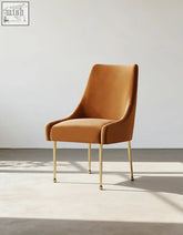 Abraham dining chair velvet in caramel with gold metal legs and casters pairs perfectly with a stylish coffee table set