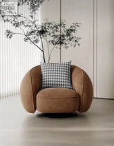 Tan suede abreu swivel accent chair round armchair with black and white houndstooth pillow for stylish seating