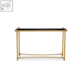 Ackley gold console table with black glass top and gold geometric frame perfect for modern entryways