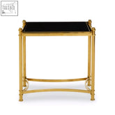 Ackley gold side table with black glass top and gold finished stainless steel frame for stylish living spaces