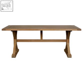 Light brown wooden dining table with rustic farmhouse design and sturdy x-shaped legs aged grey style