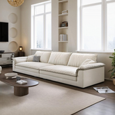 Cream-colored leather aiden sailboat two seater sofa with modern lines and subtle stitching details in suede