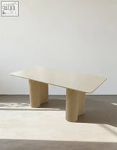 Beige aiden white dining table with ribbed wooden legs and sintered stone top perfect for stylish dining spaces