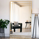 A tall aimi gold metal rectangle window mirror with segmented glass panels and sleek gold frame 180cm x 105cm