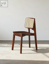 Aislin rattan dining chair with a sleek wooden frame, dark brown finish, and woven cane backrest perfect for dining chair use