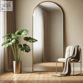 Akiko gold arched full length mirror with a gold arched metal frame measuring 150cm by 60cm