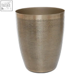 A sleek allegra gold finish waste bin in metallic with subtle wave etching for stylish trash storage