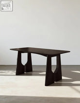 Allison dining table black solid wood with sculptural geometric legs and cut-out arches perfect as office desk