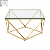 Allure gold finish twist coffee table with clear glass top and gold geometric metal frame perfect for modern coffee table setups