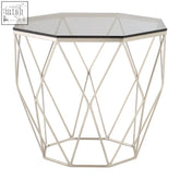 Geometric metal side table with clear glass top and brushed nickel base for modern living spaces