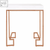 White rectangular tabletop end table with allure rose gold angled legs and geometric metal frame
