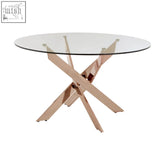 Modern rose gold dining table with intersected rose gold metal legs and a clear glass top perfect for dining rooms