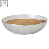 Silver metallic alma large round bowl filled with smooth light brown liquid featuring gold brushstroke detail