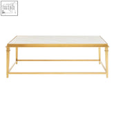 Gold-toned alvaro rectangular coffee table with mirrored top and slender legs in place of white marble surface
