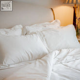 White satin pillow cases and duvet cover set with ladder stitch and oxford border in the amalfi pillow case pair
