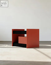 Red and black geometric wooden bedside table with minimalist modern design perfect as an ambrose wooden bedside table