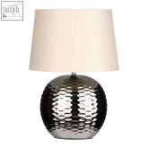 Silver hammered ceramic dimple effect table lamp with cream fabric shade perfect for stylish indoor lighting