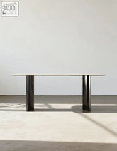 Angela dining table marble with sleek dark metal frame and glass top perfect for luxury dining and offer financing