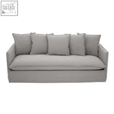 Antibes 3 seater grey sofa with plush cushions made of grey fabric featuring clean minimalist lines and linear detailing