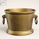 Antique brass solid cast champagne bucket cooler with gold finish and embossed cuvée de prestige text for vintage french brasserie style