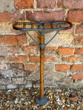 Antique Victorian bamboo shooting stick with a vintage rusted metal frame and wooden handle featuring ornate curved top