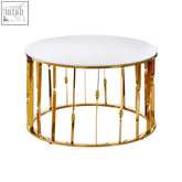 Arezzo round coffee table with gold finish frame featuring a white circular top and vertical bars with decorative beads