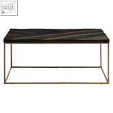 Aris black and gold coffee table with dark acacia wood top featuring diagonal stripes and mild steel gold frame