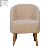 Beige faux fur armchair with tapered solid mango wood legs perfect for cozy artisan furniture seating