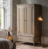 Artisan wardrobe 2 door 1 drawer made of light gray distressed wood with paneled doors and a bottom drawer