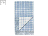 Light blue and white grid patterned merino lambswool throw blanket with fringed edges perfect for cozy use