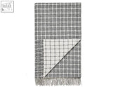 Gray and white checkered Athens check merino lambswool throw with fringed edges perfect for cozy warmth