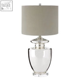 Auldwych glass table lamp with clear glass body silver metallic base and beige fabric shade for bedside use