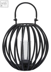 A large matte black wrought iron lantern with a curved handle and clear glass candle holder inside