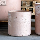 Aurella blushstone cylinder planter in matte pink pigmented concrete with textured speckled finish 13l plant pot