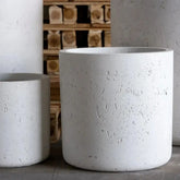 White mist aurella cylinder planter in pigmented concrete with speckled texture and clean cylindrical shape 55cm tall
