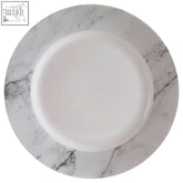 White ceramic plate with smooth glossy finish on grey marble effect surface from avie dinner set
