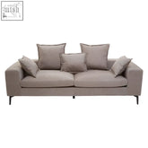 Beige avignon 3 seat grey sofa with polyester upholstery matching pillows and sleek black legs for modern living